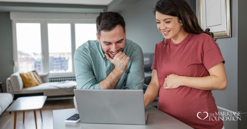 pregnant-woman-talking-to-husband-infront-of-a-laptop